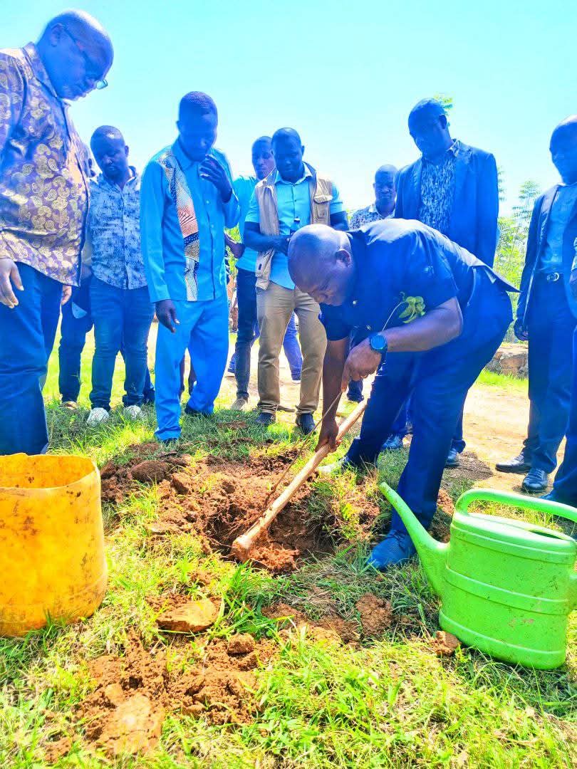 Community volunteers of all ages planting trees together at Ambururu Waterfalls